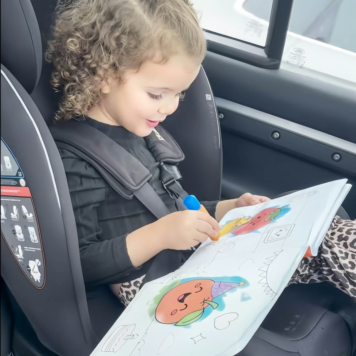 Child colouring in the car